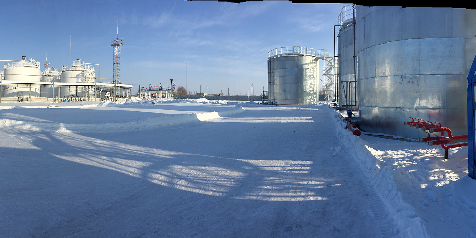 Storage tanks in winter panorama